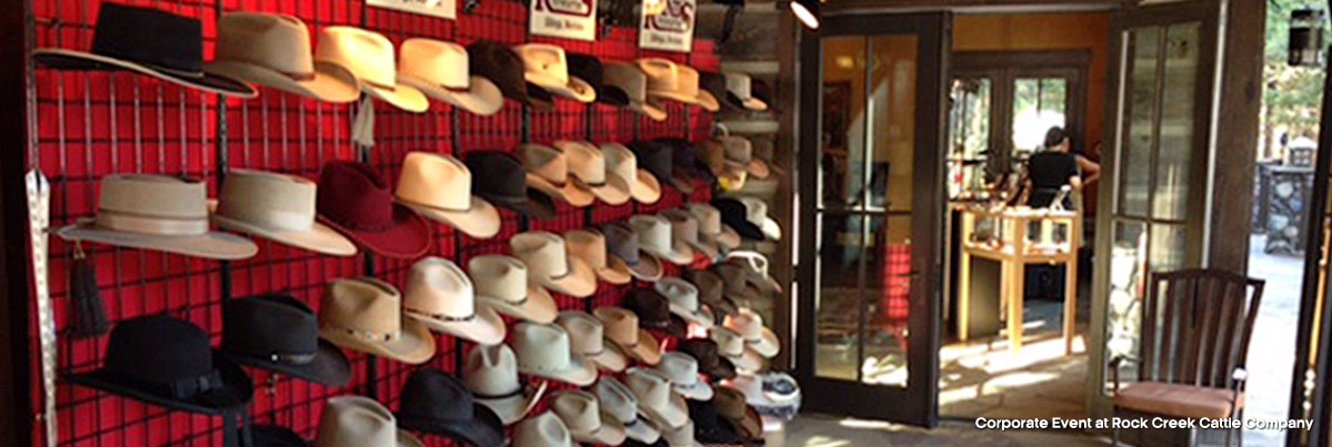 wall of hats on display at a corporate event at Rock Creek Cattle Company